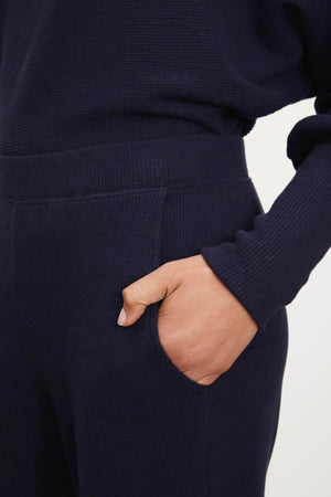 Navy ribbed joggers by Weekend Max Mara. 

New Sentence: KACIE BRUSHED RIB PANT by Velvet by Graham & Spencer.