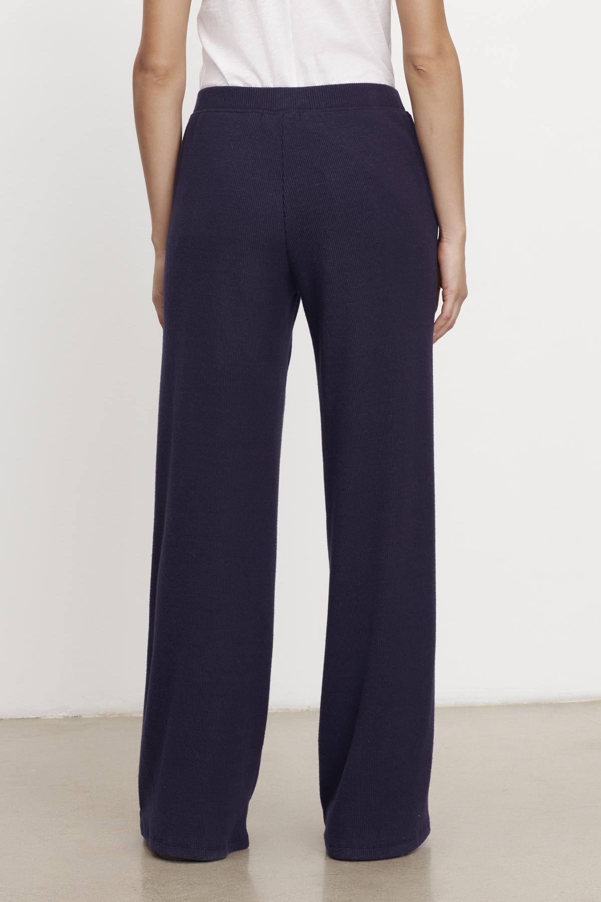 The back view of a woman wearing Velvet by Graham & Spencer's KACIE BRUSHED RIB PANT.-35701975548097