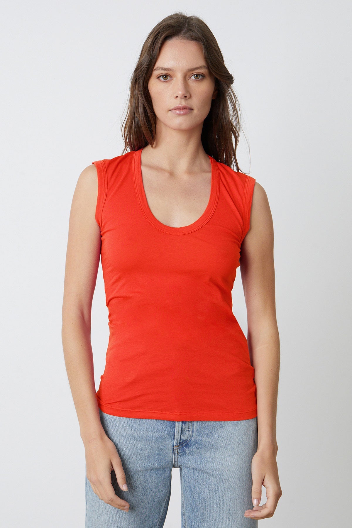 Estina Fitted Tank Top in bright cardinal red gauzy whisper with light blue denim front-26715129741505