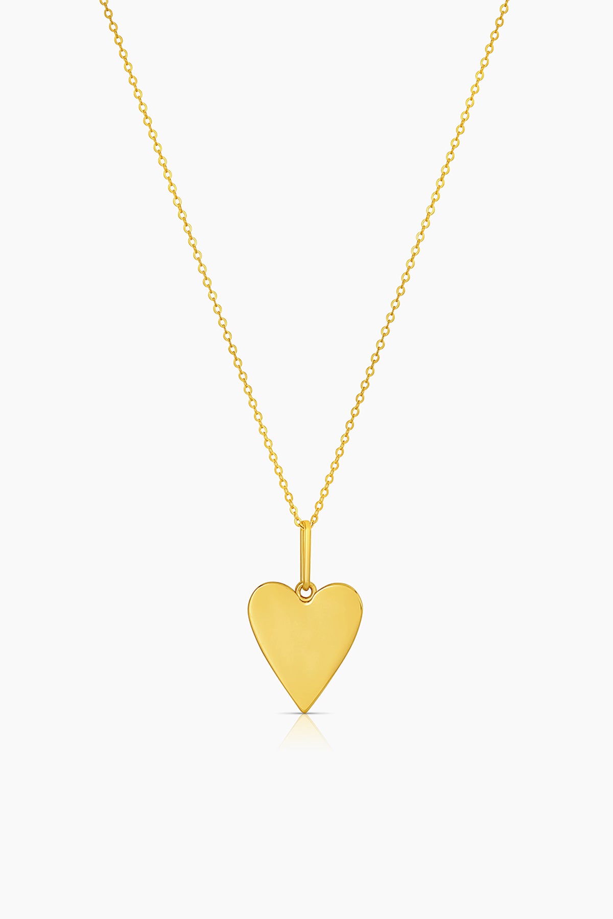   A small AMAYA HEART NECKLACE BY THATCH pendant on a chain. 