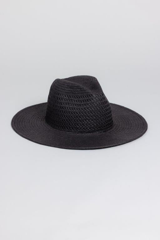 The LUXE VENTED PACKABLE HAT by Velvet by Graham & Spencer, featuring a wide brim and creased crown, is crafted from natural paper straw and shown against a plain light grey background.
