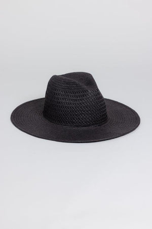 The LUXE VENTED PACKABLE HAT by Velvet by Graham & Spencer, featuring a wide brim and creased crown, is crafted from natural paper straw and shown against a plain light grey background.
