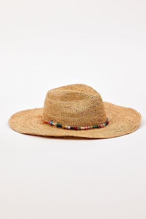 The MILLIE CONTINENTAL HAT by Velvet by Graham & Spencer is a wide-brimmed woven straw hat featuring a beaded band around the crown, shown against a plain white background.