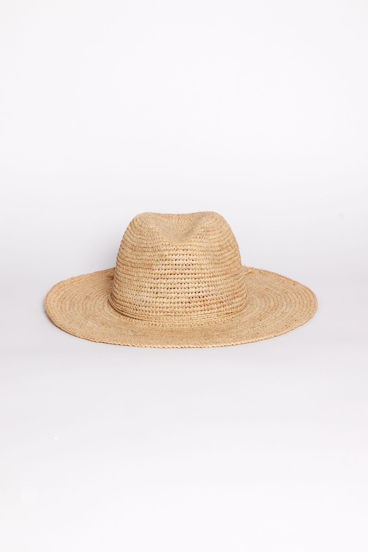 The AMELIA FEDORA by Velvet by Graham & Spencer is a wide-brimmed straw hat with a woven texture, shown against a plain white background.