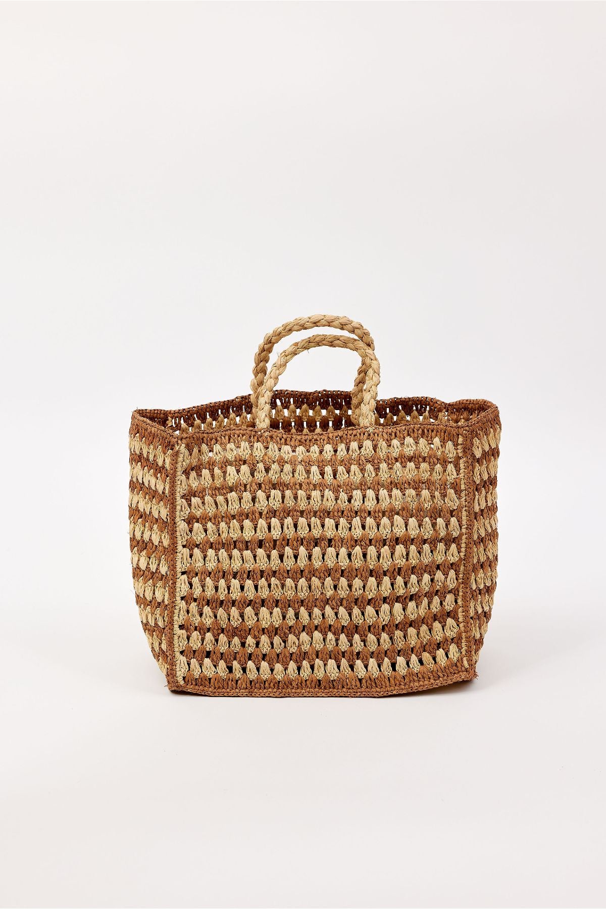 The MELODY BAG by Velvet by Graham & Spencer is a woven straw tote with two short handles and a brown and beige checkered pattern, shown on a plain white background.-41393567727809