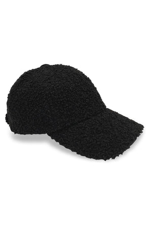A black SHERPA CAP by Velvet by Graham & Spencer featuring a eco faux-sherpa lining, perfect for cold-weather occasions, on a white background.
