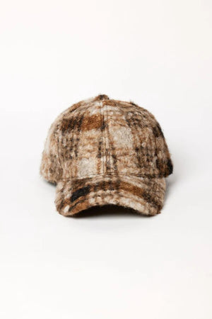 The SHERPA CAP by Velvet by Graham & Spencer features a brown and beige plaid wool design with faux-sherpa lining, perfect for cold-weather days, shown on a plain white background.