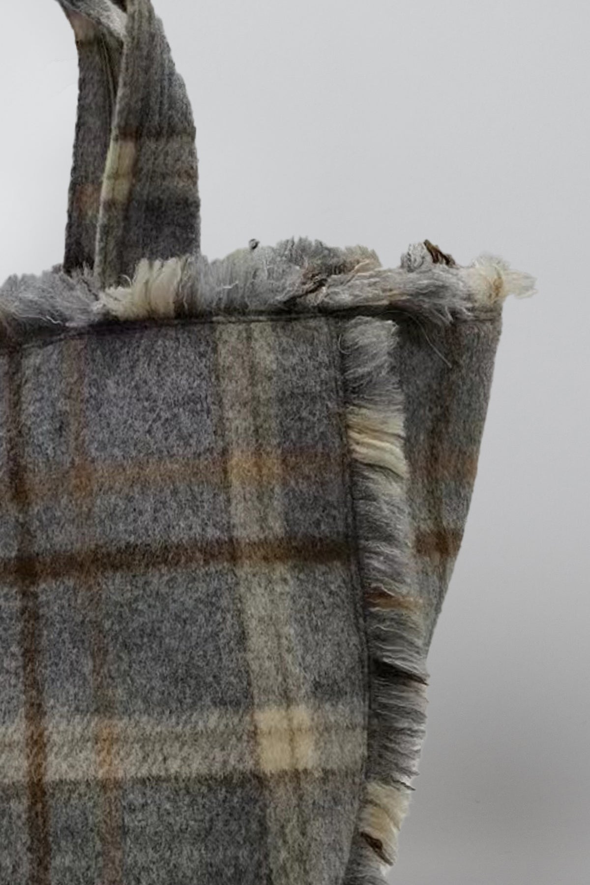   Detail of Frayed Flannel Tote in grey plaid frayed seams and fabric 