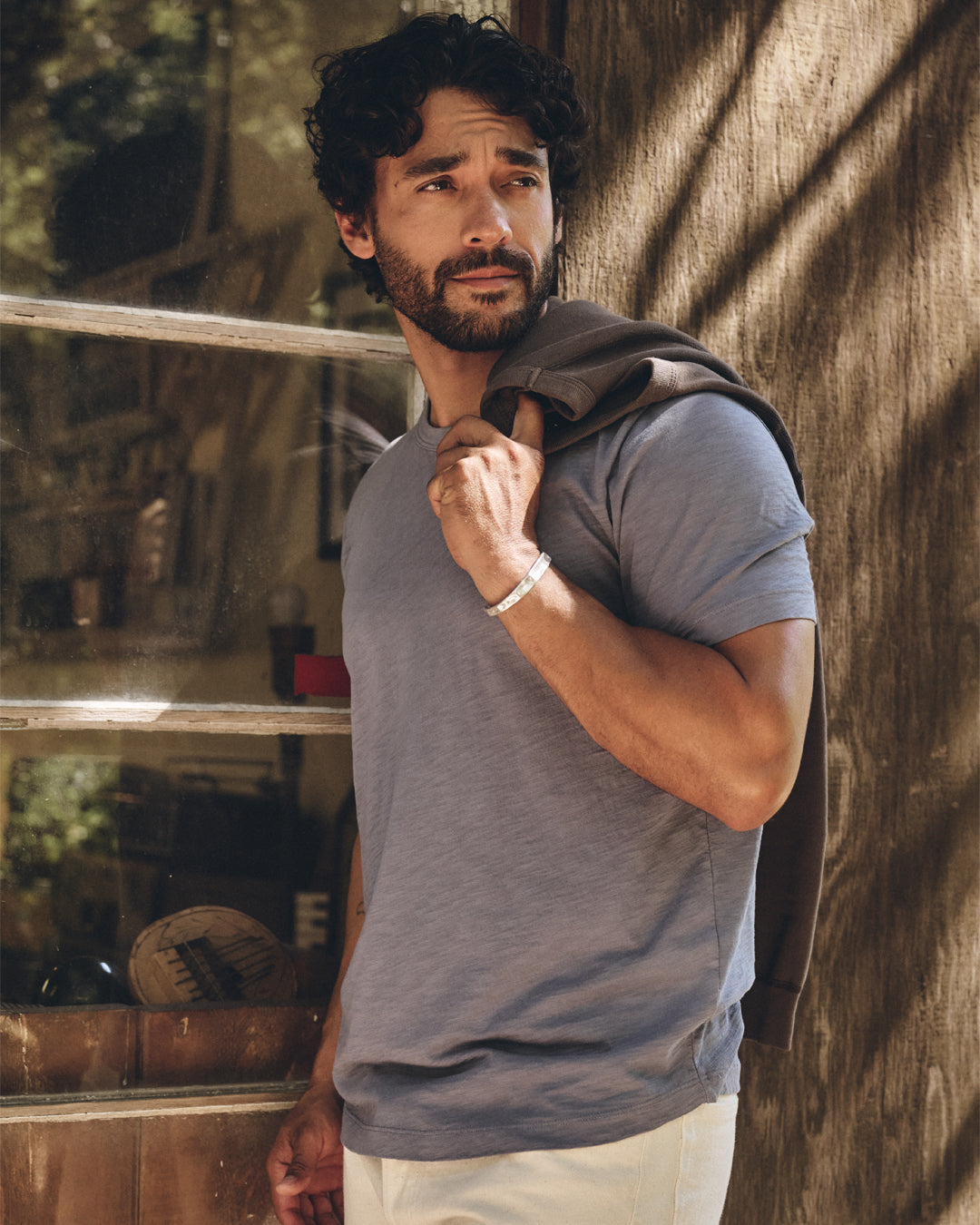 A man wearing a Velvet by Graham & Spencer tee shirt.