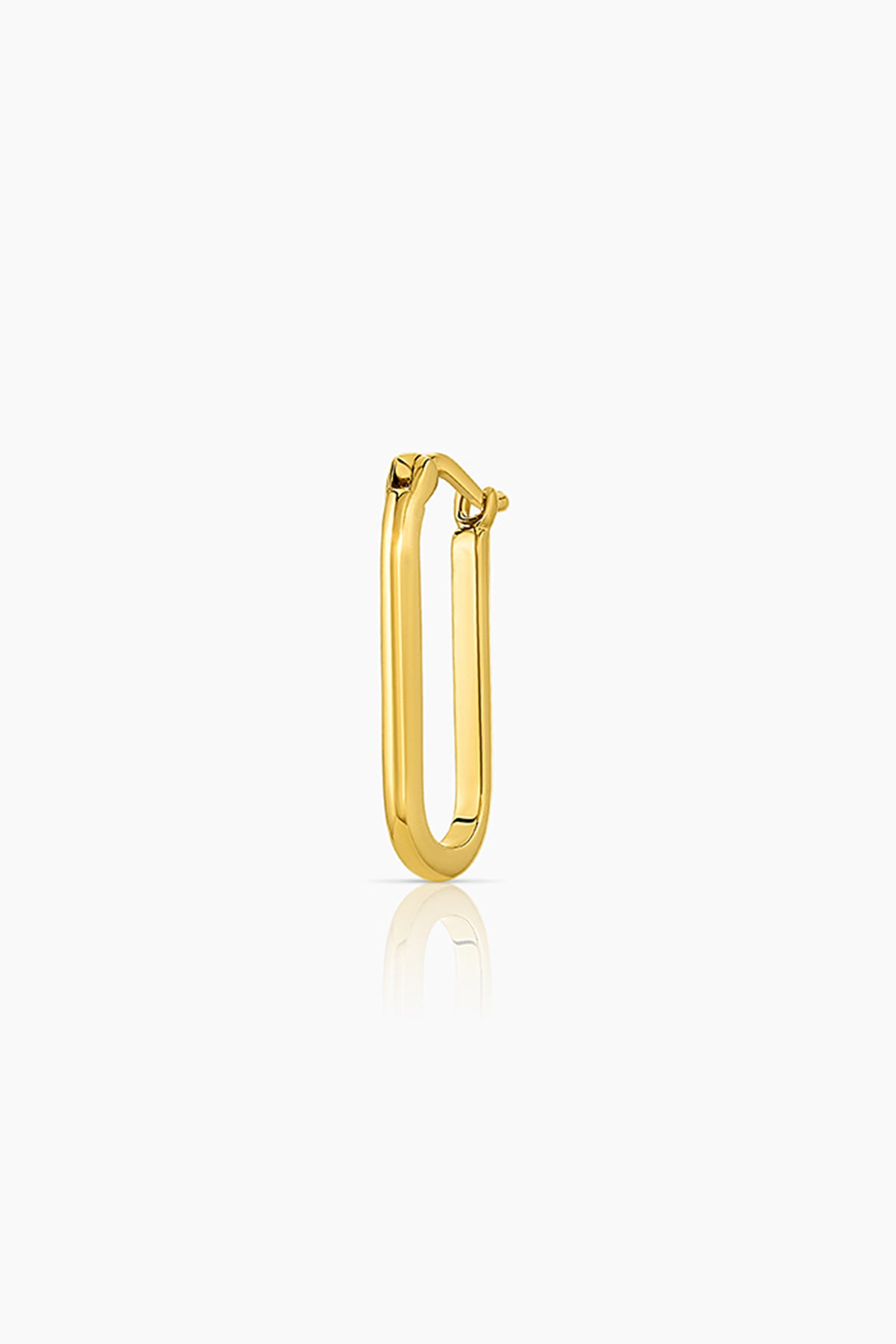  A small yellow gold NADINE ELONGATED HOOPS earring by Thatch. 