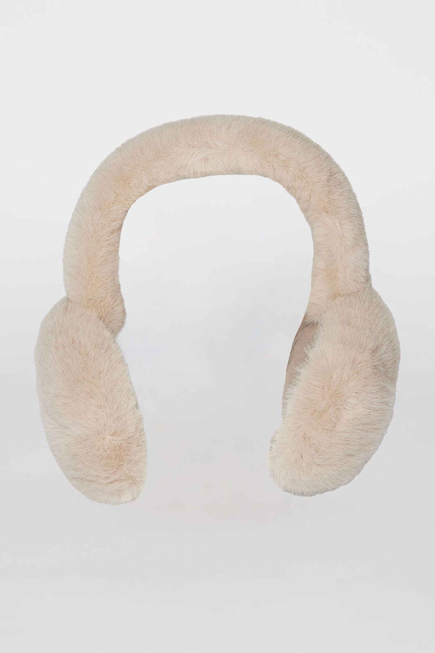   A pair of FAUX FUR EARMUFFS by Velvet by Graham & Spencer, featuring a simple design in beige fluffy material, displayed against a plain white background. 