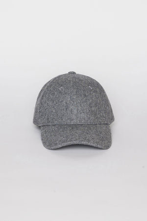 The SOLID SHETLAND CAP by Velvet by Graham & Spencer is a gray baseball cap featuring a curved brim and two ventilation holes on the front panels, displayed against a plain white background.