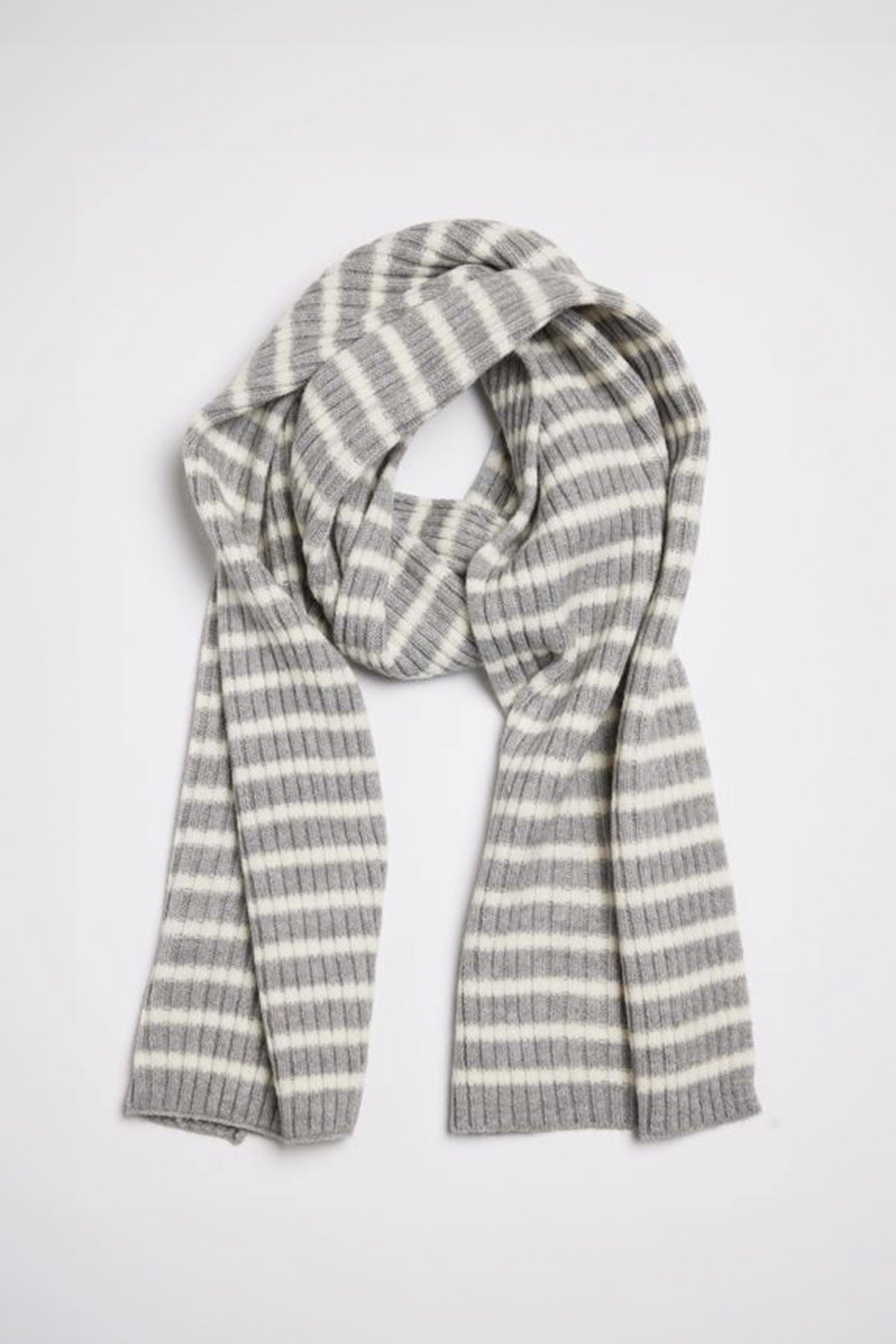   The BOLTON STRIPE SCARF by Velvet by Graham & Spencer, featuring gray and white stripes, is neatly folded and laid flat against a plain white background. 