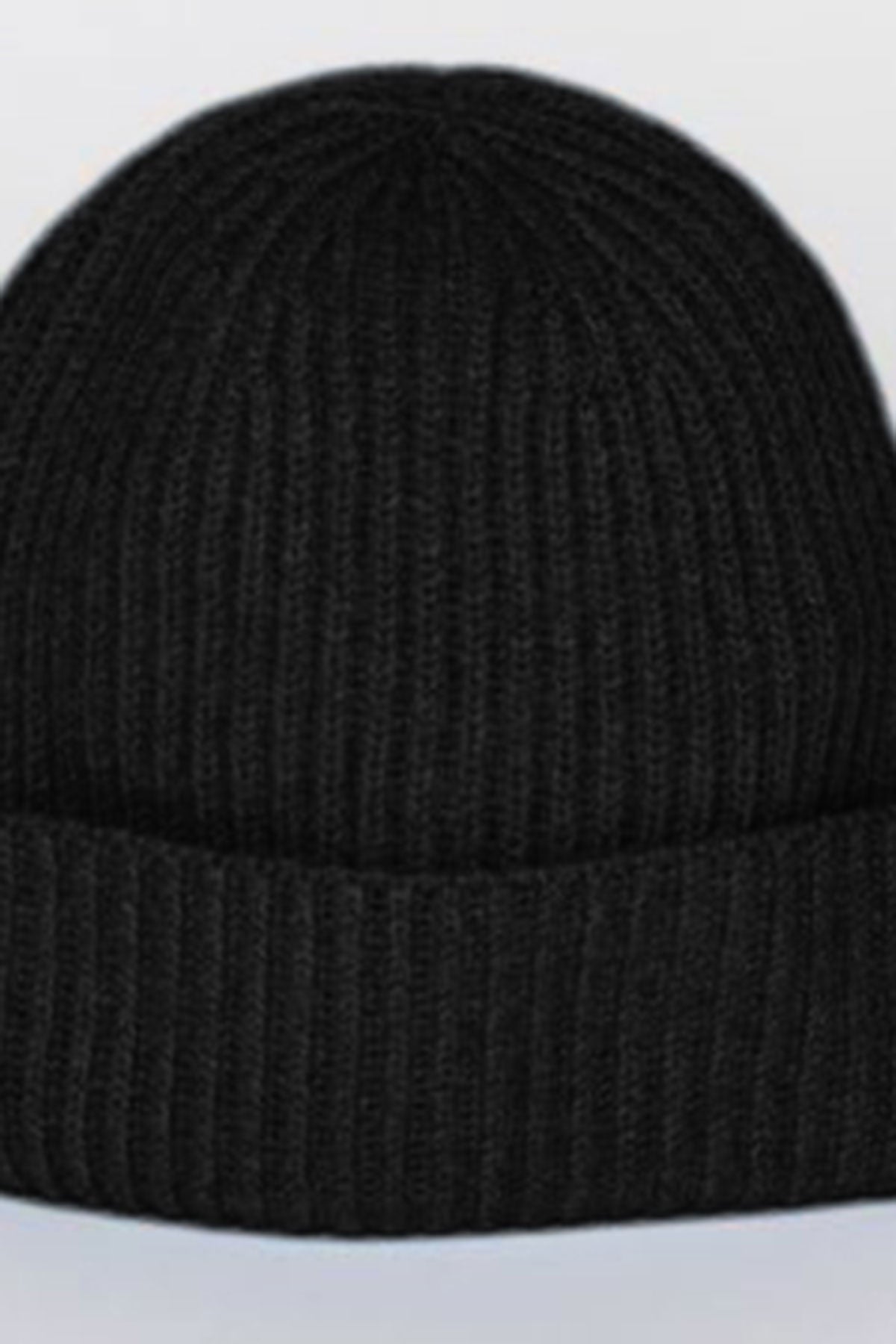   A versatile CASHMERE RIB BEANIE by Velvet by Graham & Spencer in black featuring a ribbed design and folded brim. 