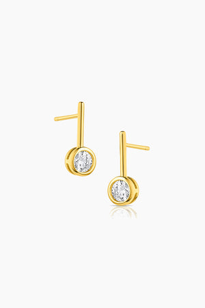 A pair of NOEMI earrings by Thatch with diamonds.