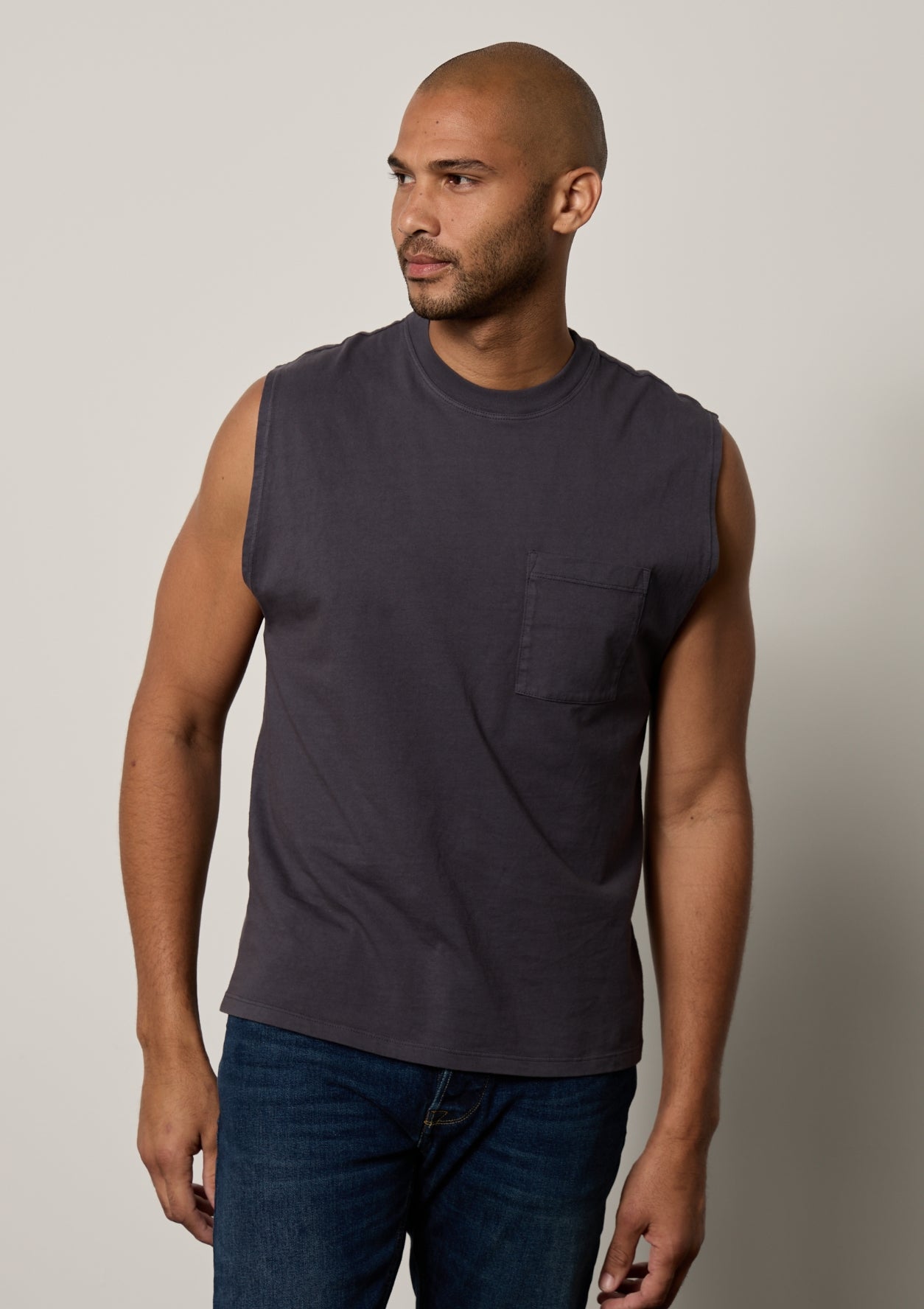a man wearing a gray Velvet by Graham & Spencer Layne Crew Neck Muscle Tee.