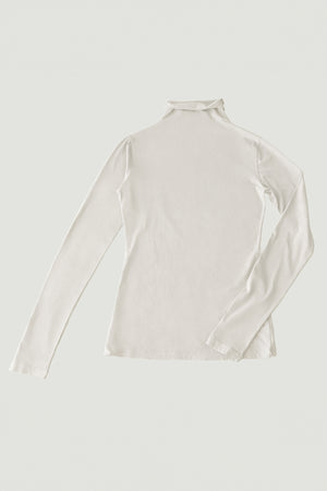 Image of the Velvet by Graham & Spencer TALISIA TEE, a long-sleeved, cream-colored turtleneck shirt laid flat on a light background, showcasing its fashion-forward appeal and the versatility it adds to any wardrobe.