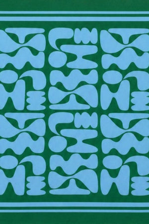 Blue geometric pattern with a green border scarf against a beige background