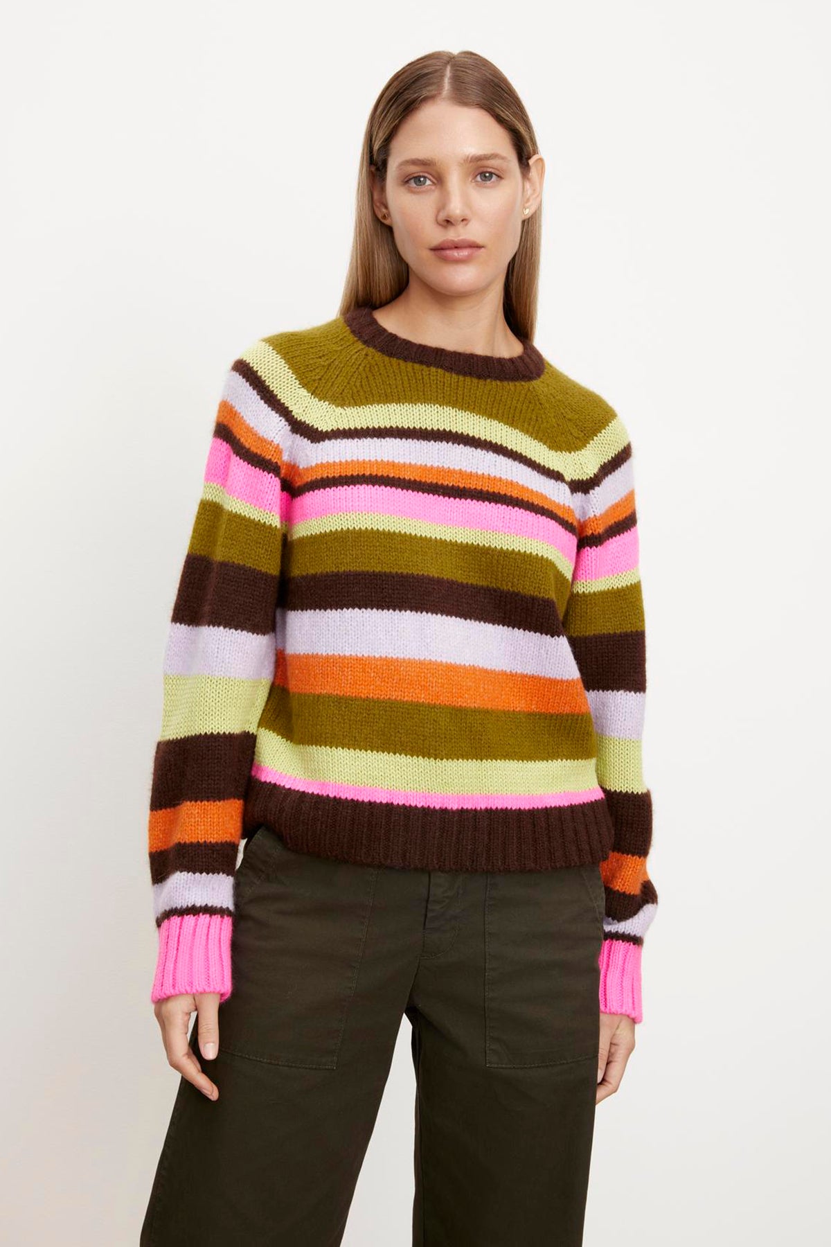   A woman wearing a Nessie Striped Crew Neck Sweater made of alpaca blend fibers from Velvet by Graham & Spencer. 