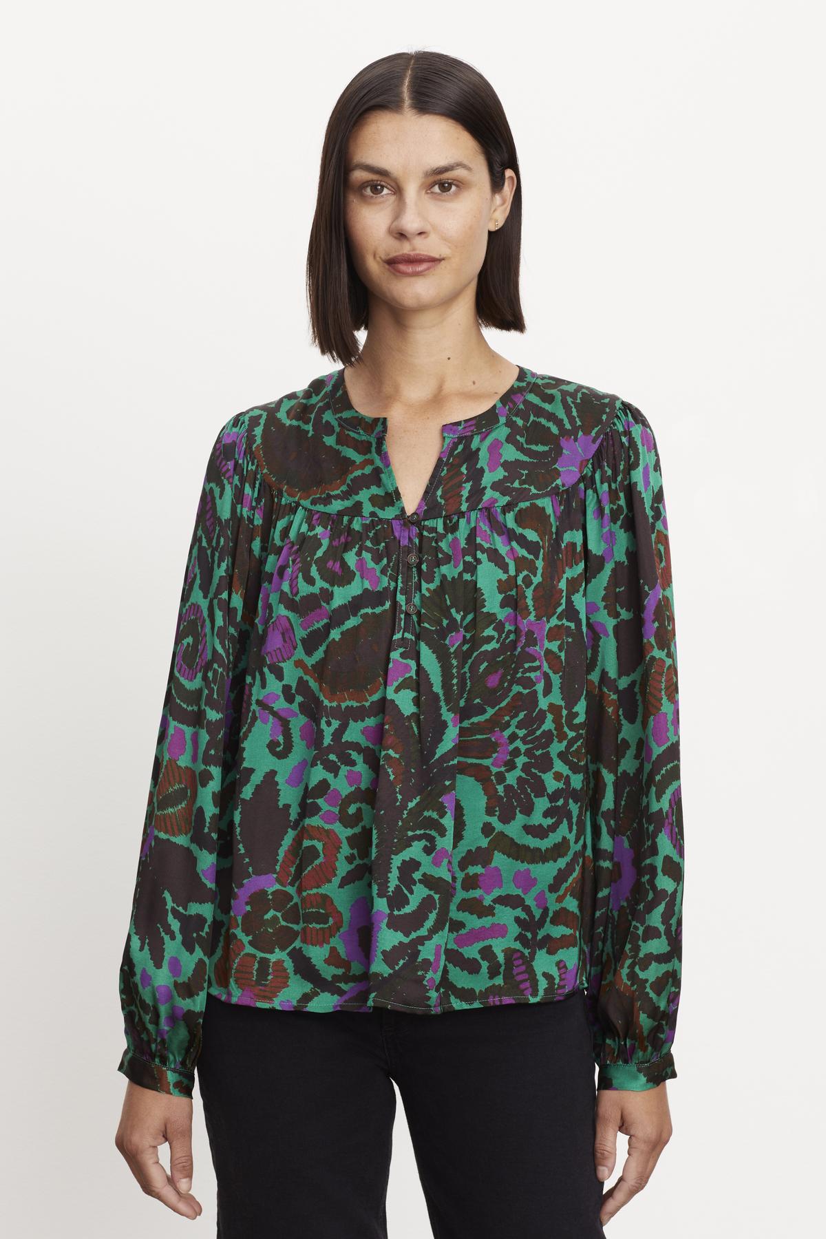 A woman wearing a Velvet by Graham & Spencer REEVE PRINTED PEASANT BLOUSE.-36094373200065