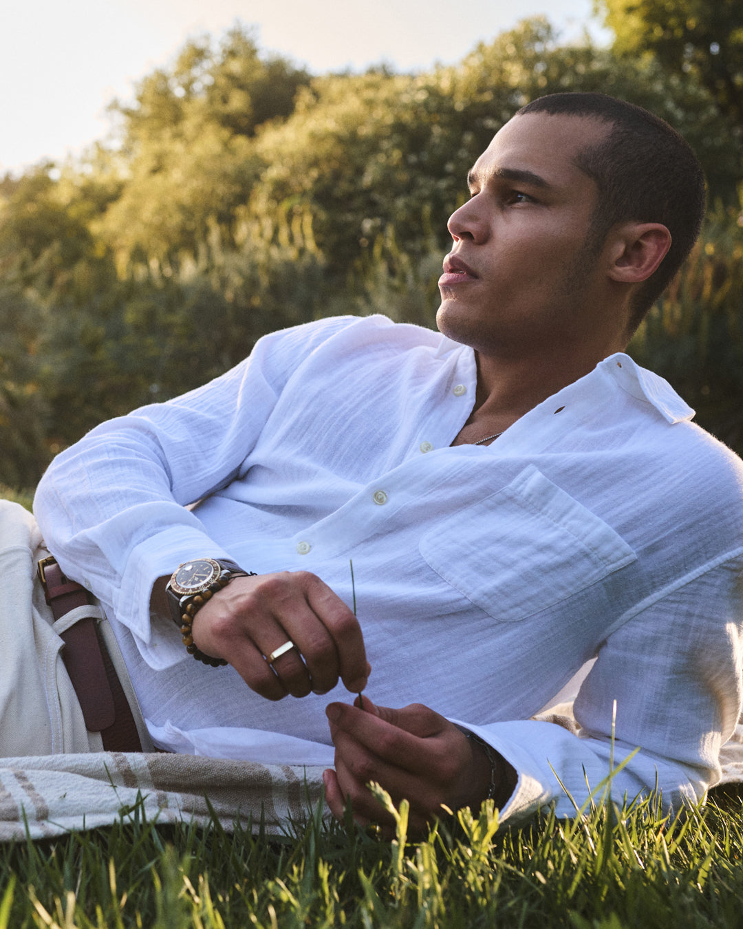 A man wearing the Apollo in White by Velvet by Graham & Spencer.