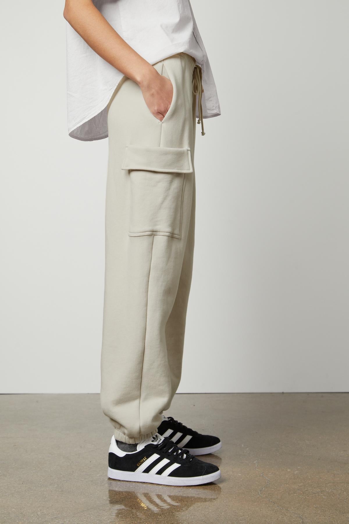   The model is wearing Velvet by Graham & Spencer LUMI DRAWSTRING WAIST SWEATPANT for everyday wear. 