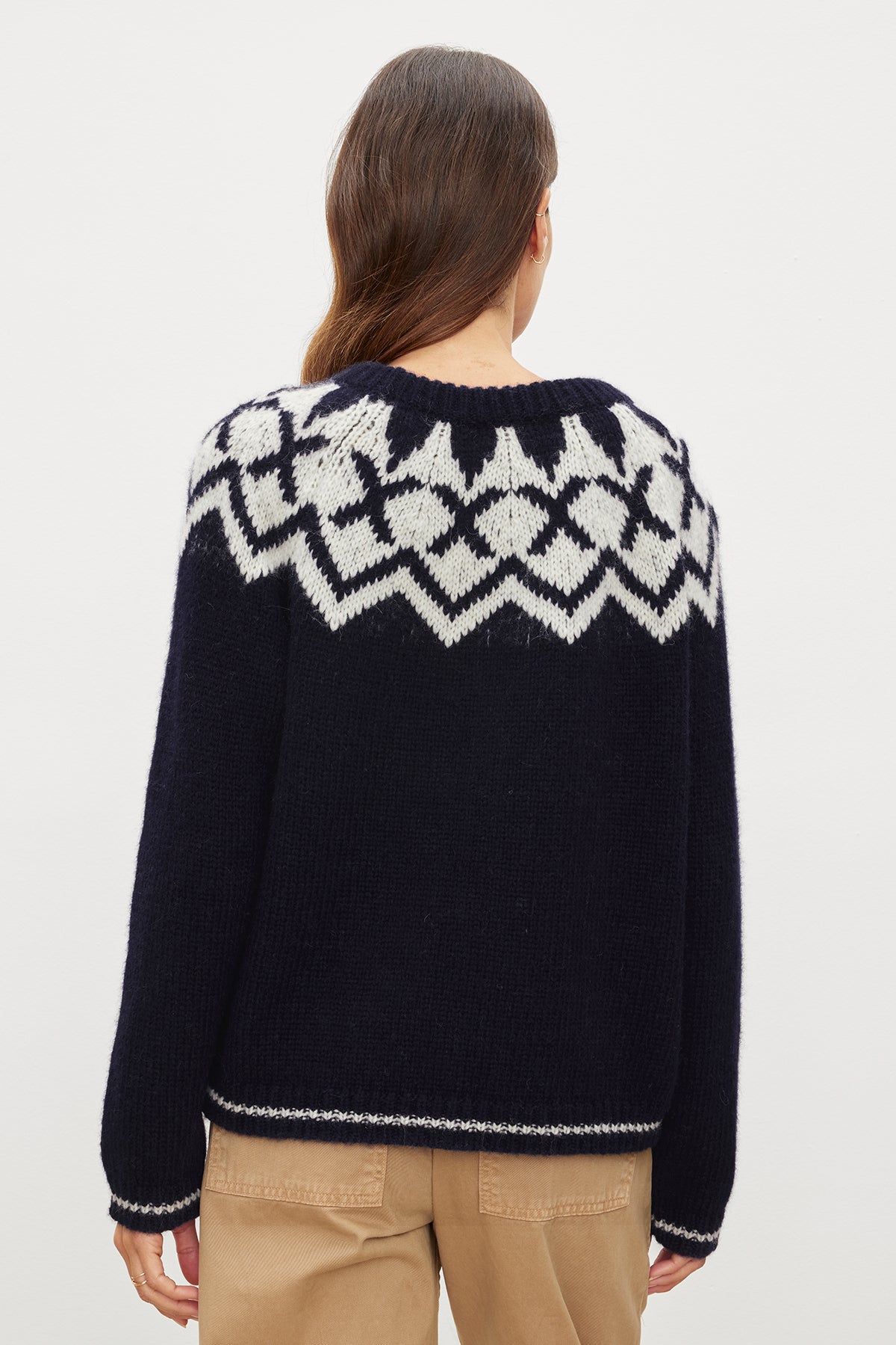 The back view of a woman wearing a Velvet by Graham & Spencer Alexa Fair Isle Crew Neck Sweater.-35572030111937