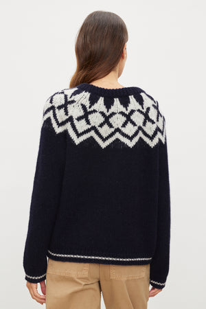 The back view of a woman wearing a Velvet by Graham & Spencer Alexa Fair Isle Crew Neck Sweater.