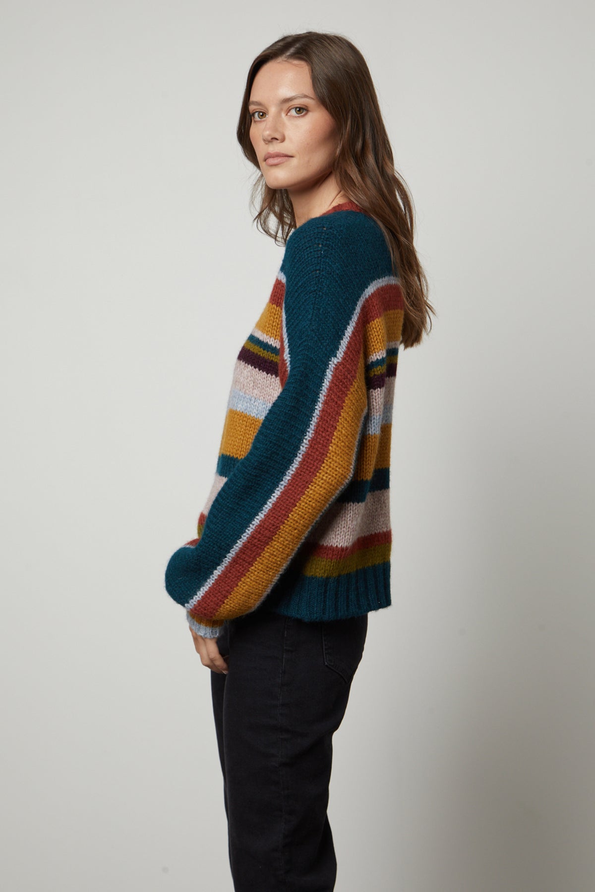   The model is wearing a SAMARA STRIPED CREW NECK SWEATER from Velvet by Graham & Spencer. 