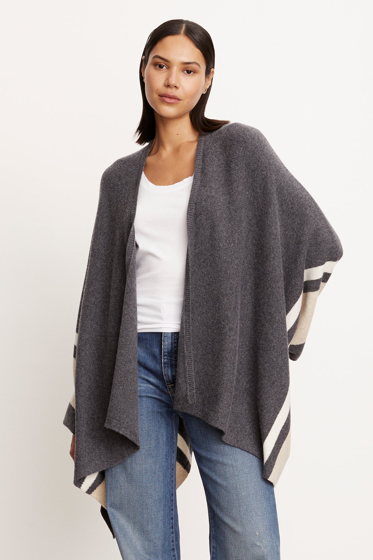 A model bundled up in a Velvet by Graham & Spencer HARPER OPEN FRONT PONCHO.-35430807732417