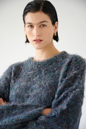 The model is wearing a versatile VALENCIA sweater by Velvet by Jenny Graham that is perfect for any wardrobe.