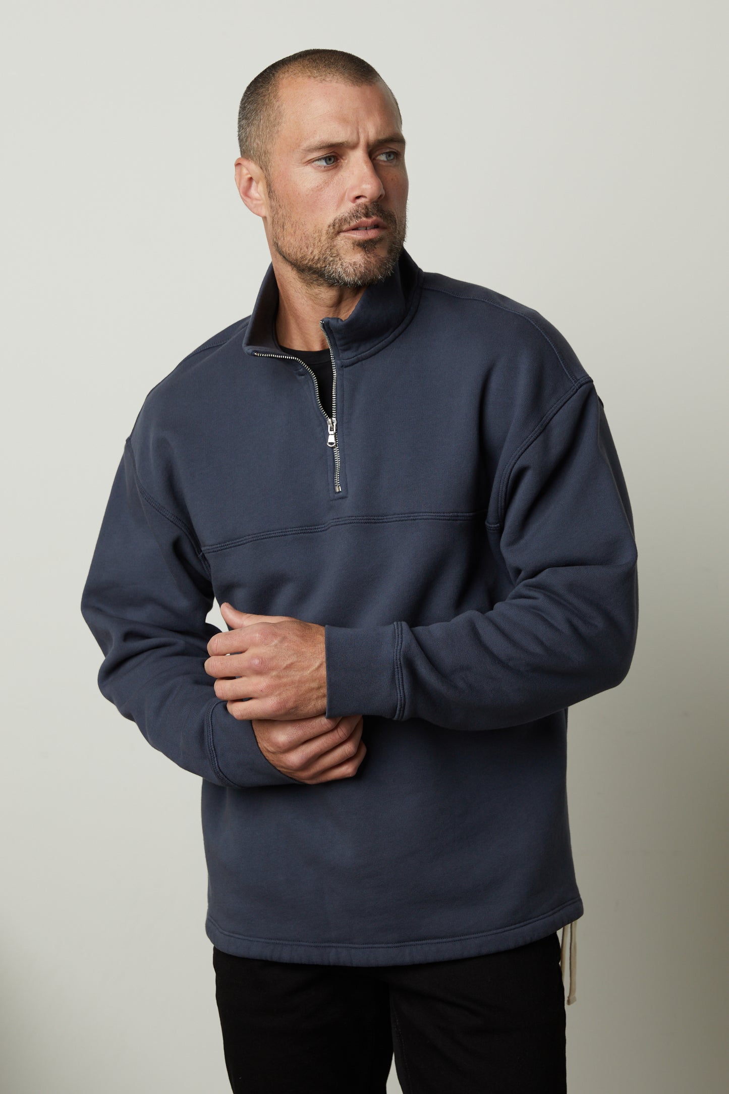 A man wearing a Velvet by Graham & Spencer Bosco quarter-zip sweatshirt in soft brushed fleece.-35472030367937