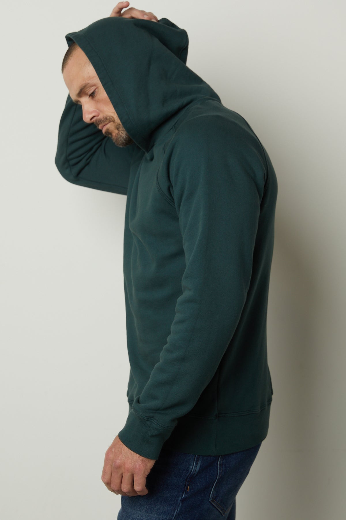 A man wearing a warm Velvet by Graham & Spencer HOPKIN PULLOVER HOODIE.-35782823280833