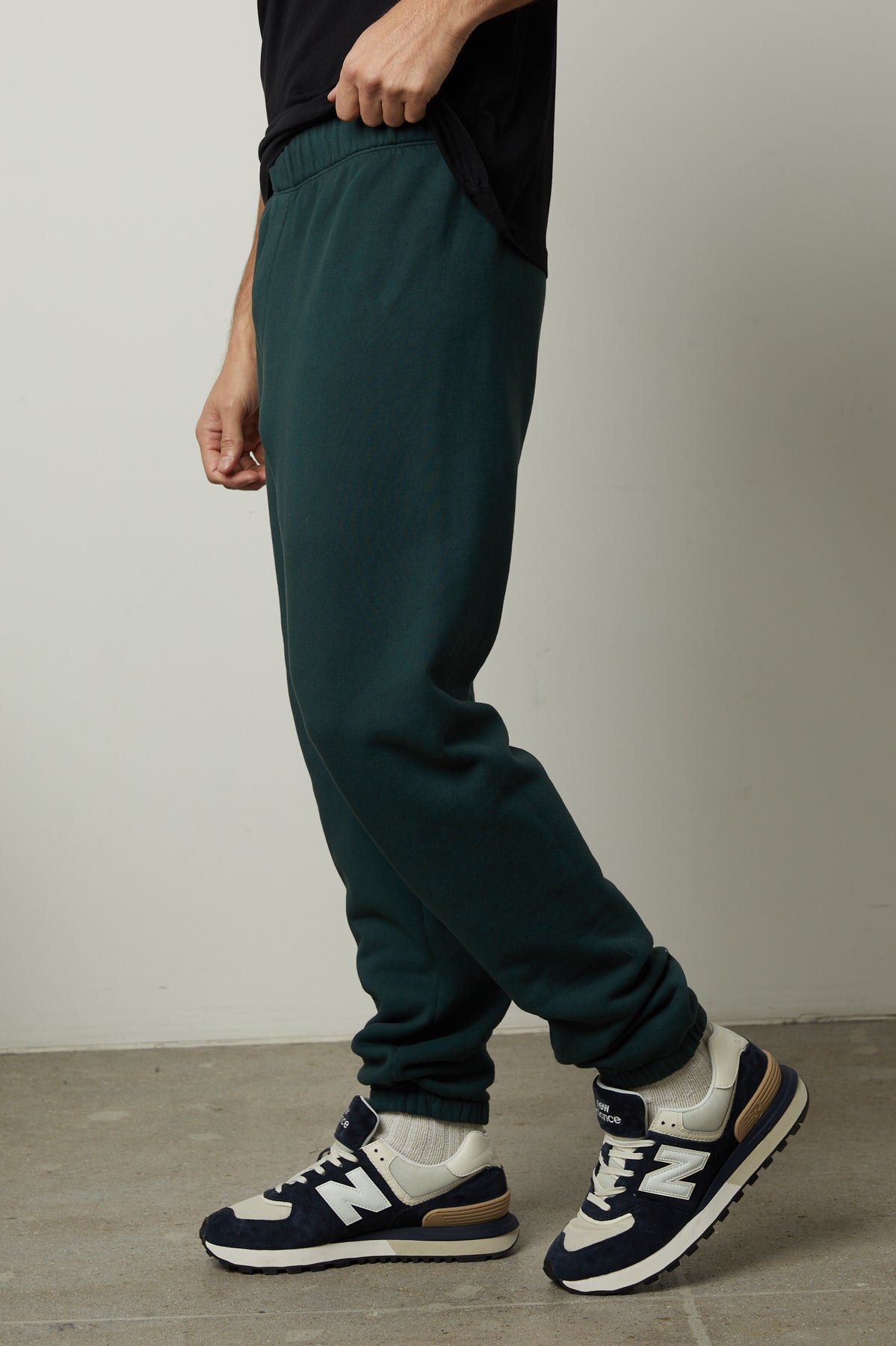 A man wearing Velvet by Graham & Spencer's MONTGOMERY BRUSHED FLEECE SWEATPANT with elastic waist.-35231570395329