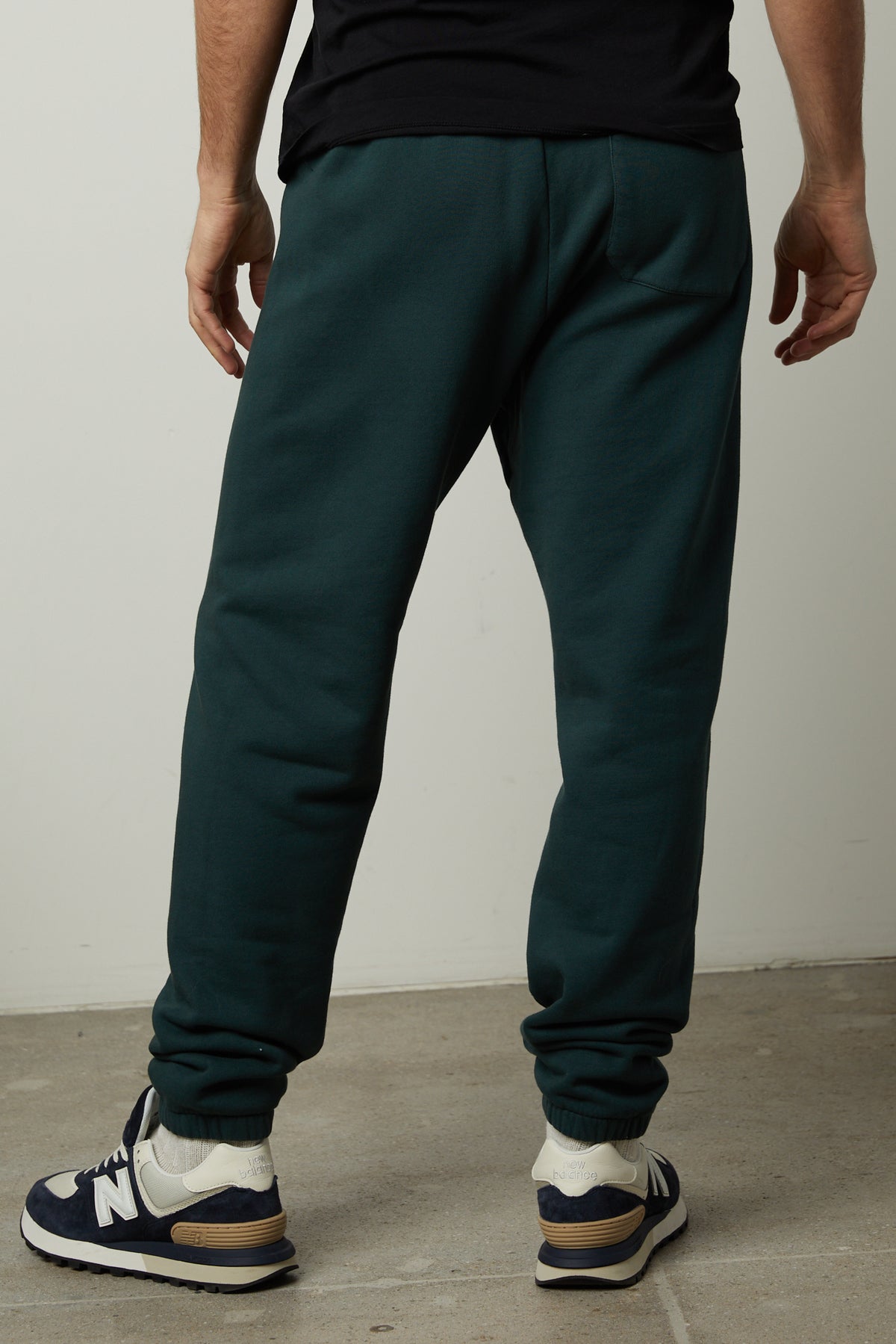   The back of a man wearing Velvet by Graham & Spencer MONTGOMERY BRUSHED FLEECE SWEATPANT with elastic waist. 