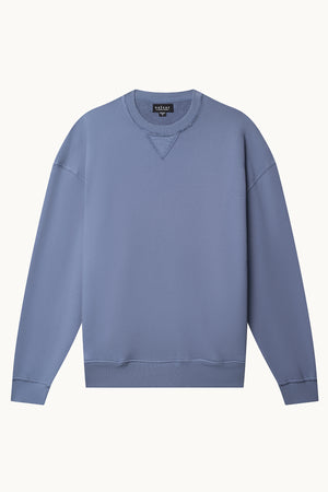 The FORREST SWEATSHIRT from Velvet by Graham & Spencer is a plain blue crewneck crafted in soft cotton fleece, designed with a relaxed fit and ribbed details on the neckline, cuffs, and hem.