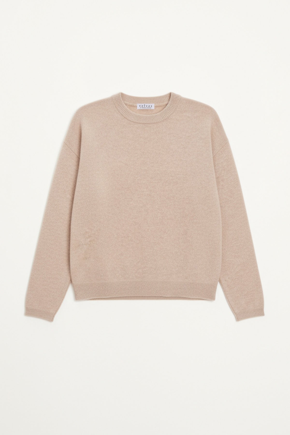 The BRYNNE CASHMERE SWEATER by Velvet by Graham & Spencer, in beige with long sleeves, relaxed shoulders, and ribbed trims, is laid flat on a white background.-40278713532609