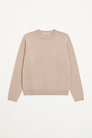 The BRYNNE CASHMERE SWEATER by Velvet by Graham & Spencer, in beige with long sleeves, relaxed shoulders, and ribbed trims, is laid flat on a white background.