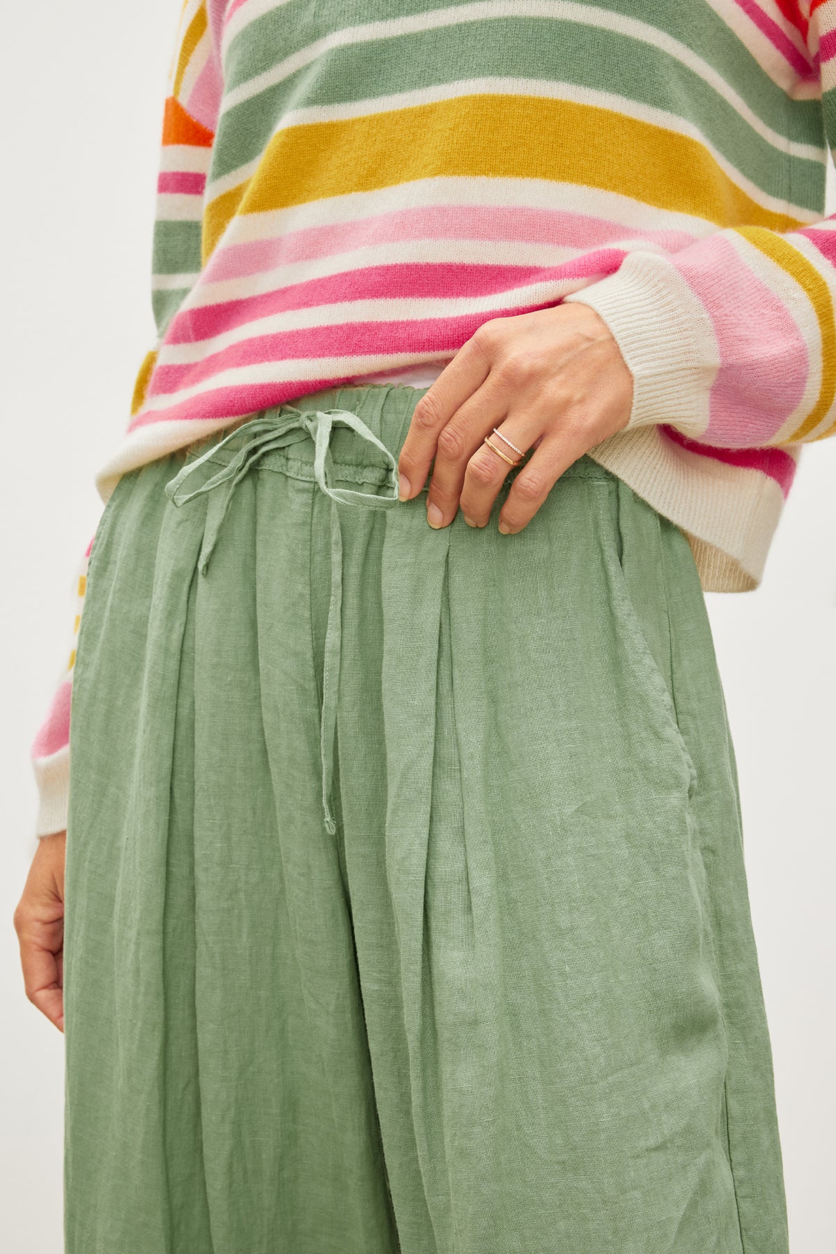 A woman wearing a green Velvet by Graham & Spencer Hannah Linen Wide Leg Pant.-35982213349569