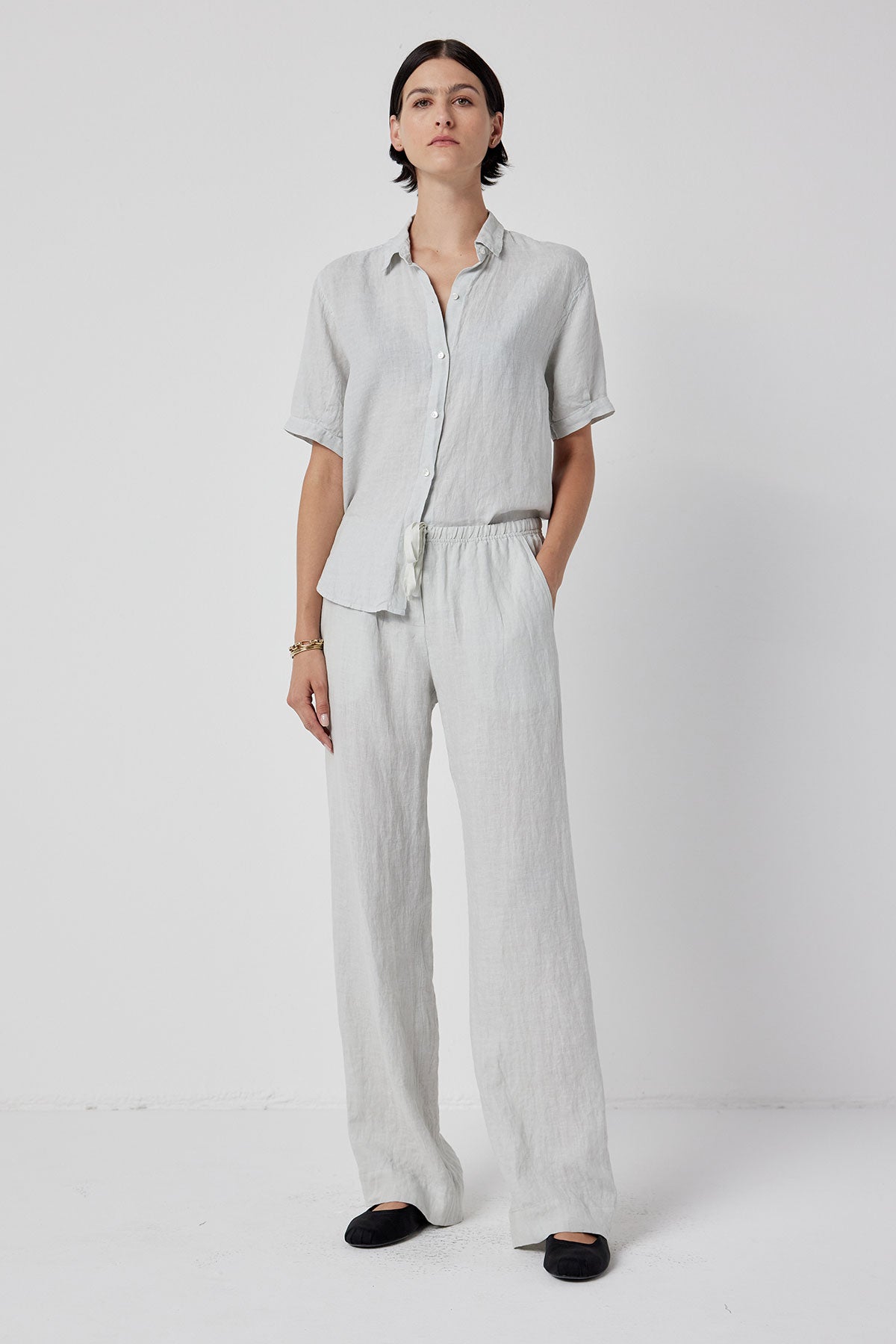 The model is wearing a white linen pant and a MULHOLLAND SHIRT by Velvet by Jenny Graham.-36212581040321