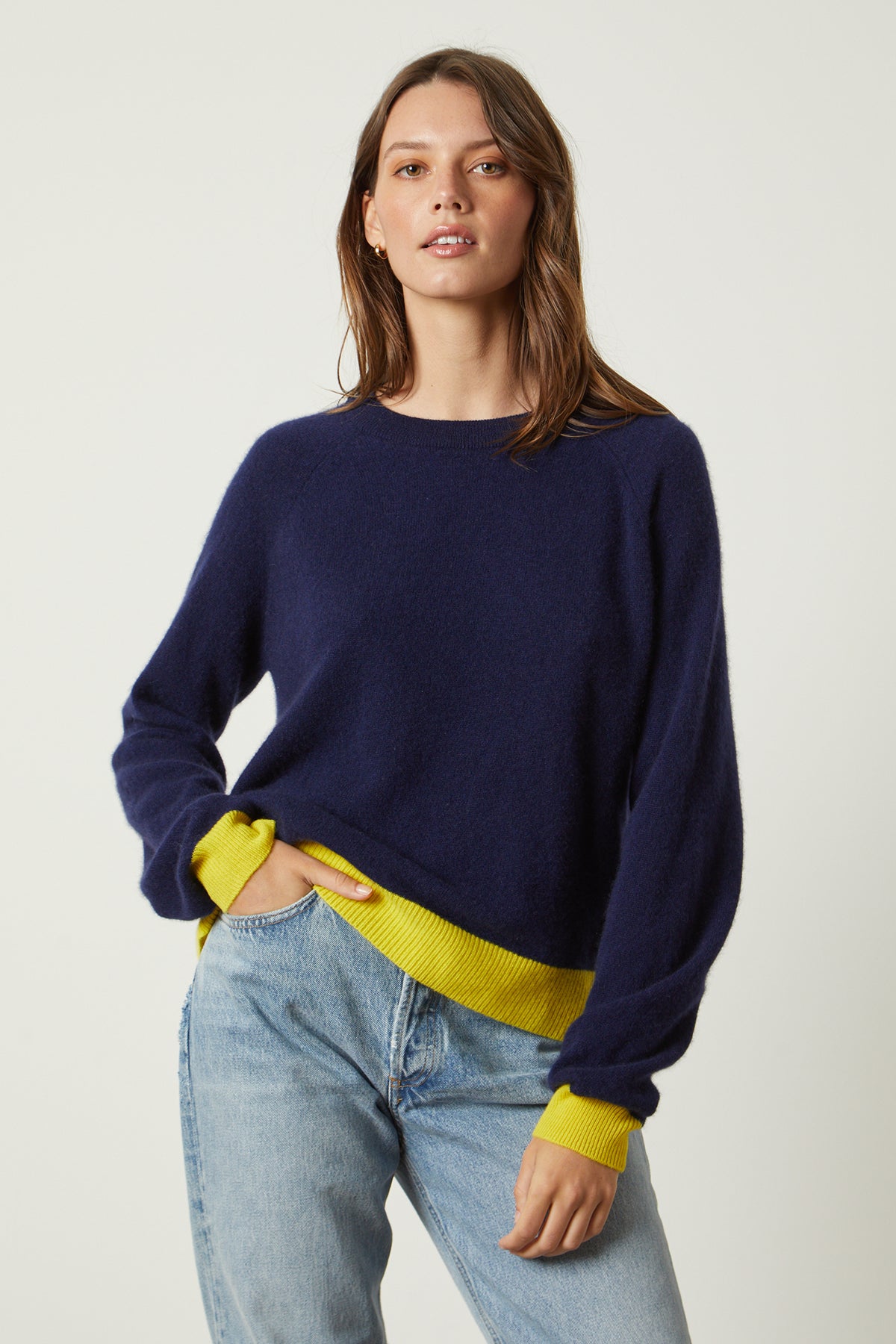 the model is wearing jeans and a Velvet by Graham & Spencer CLAIRE CASHMERE CREW NECK SWEATER.-26496314245313
