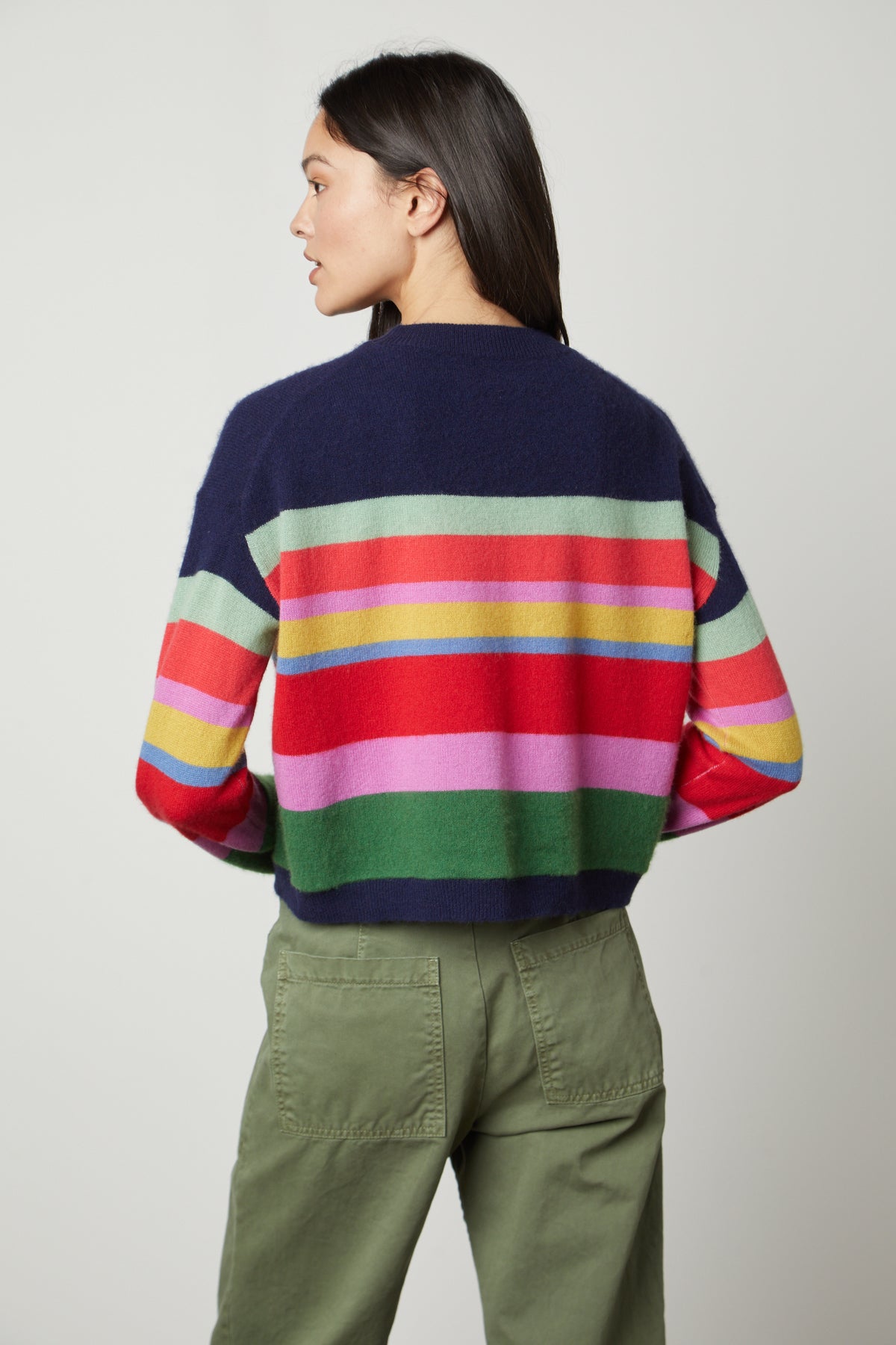   The back view of a woman wearing a Velvet by Graham & Spencer KACEY CASHMERE STRIPED CREW NECK SWEATER. 