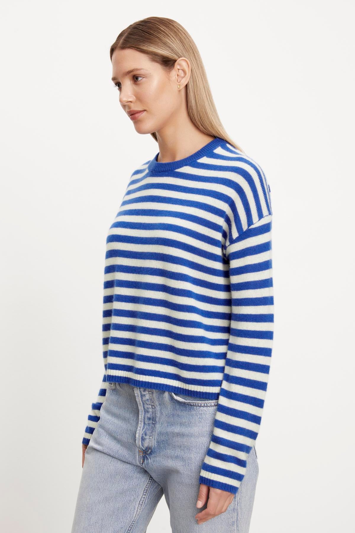 The model is wearing a Velvet by Graham & Spencer ALYSSA CASHMERE STRIPED CREW NECK SWEATER.-35702033154241
