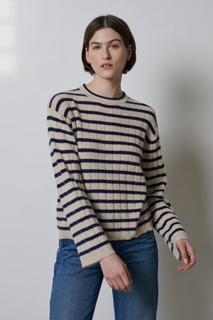 A model wearing a striped Velvet by Jenny Graham NAPA sweater.