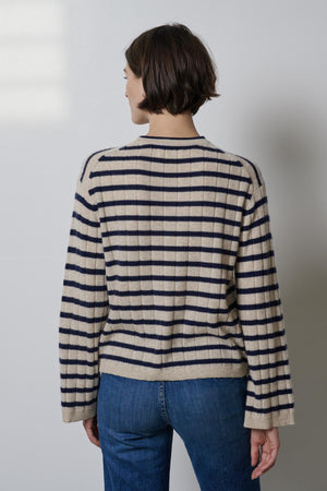 The back view of a woman wearing a Velvet by Jenny Graham NAPA SWEATER and jeans.