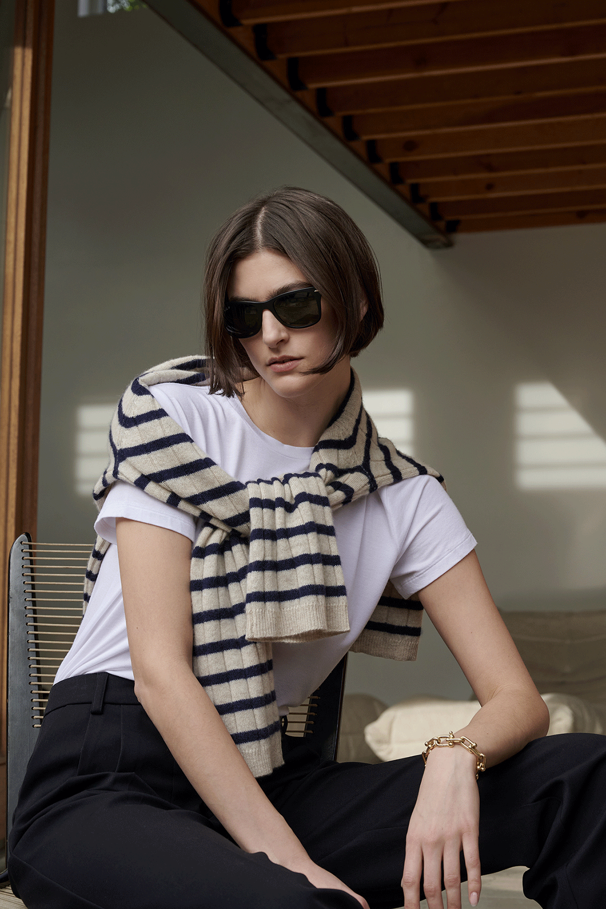   A woman wearing sunglasses and a Velvet by Jenny Graham NAPA SWEATER. 