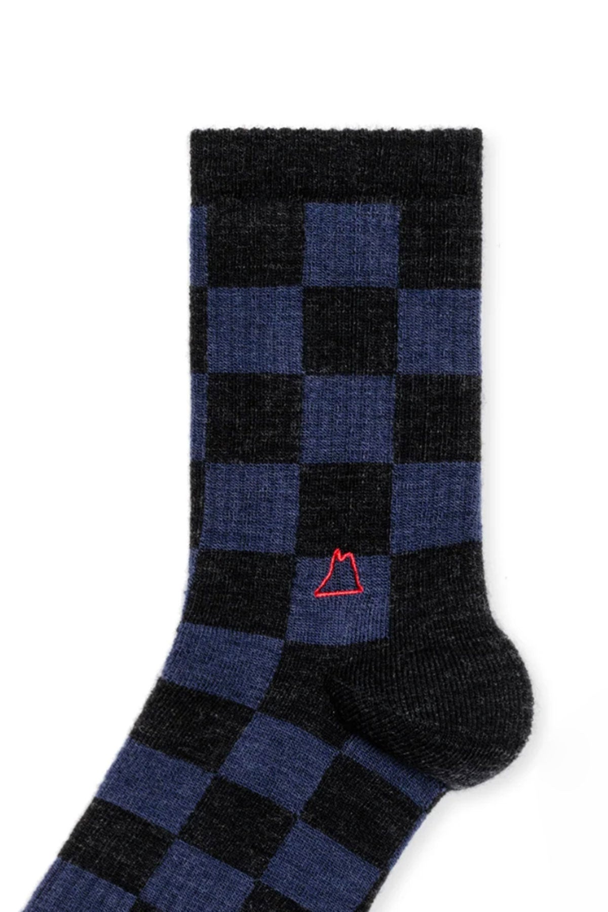   A black and blue checkered sock featuring a small red embroidered mountain design near the ankle area, these CHECKERED WOOL SPORTY SOCKS BY HANSEL FROM BASEL showcase unique designs fit for any fashion-forward individual. 