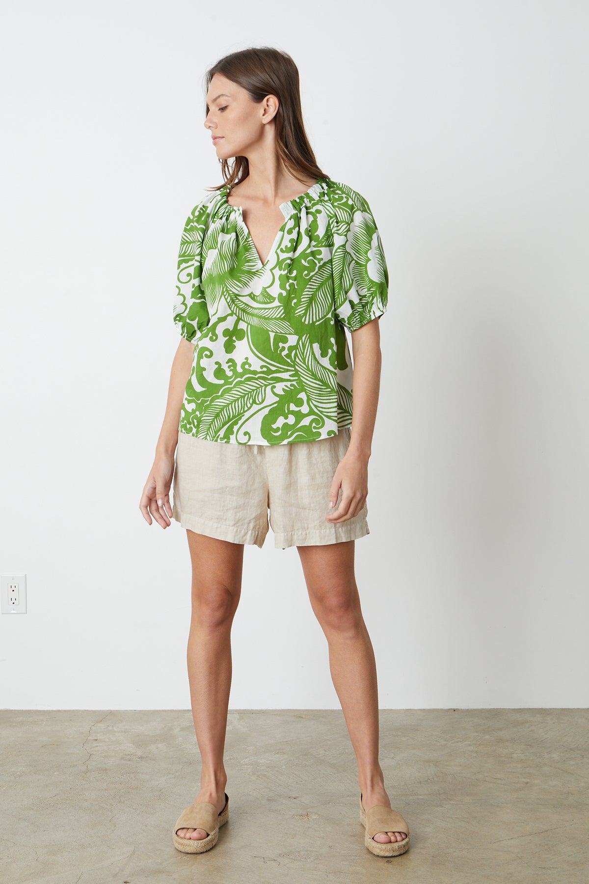   the model is wearing a green ANGELA PRINTED BOHO TOP and shorts by Velvet by Graham & Spencer with Tammy shorts and slides full length front 