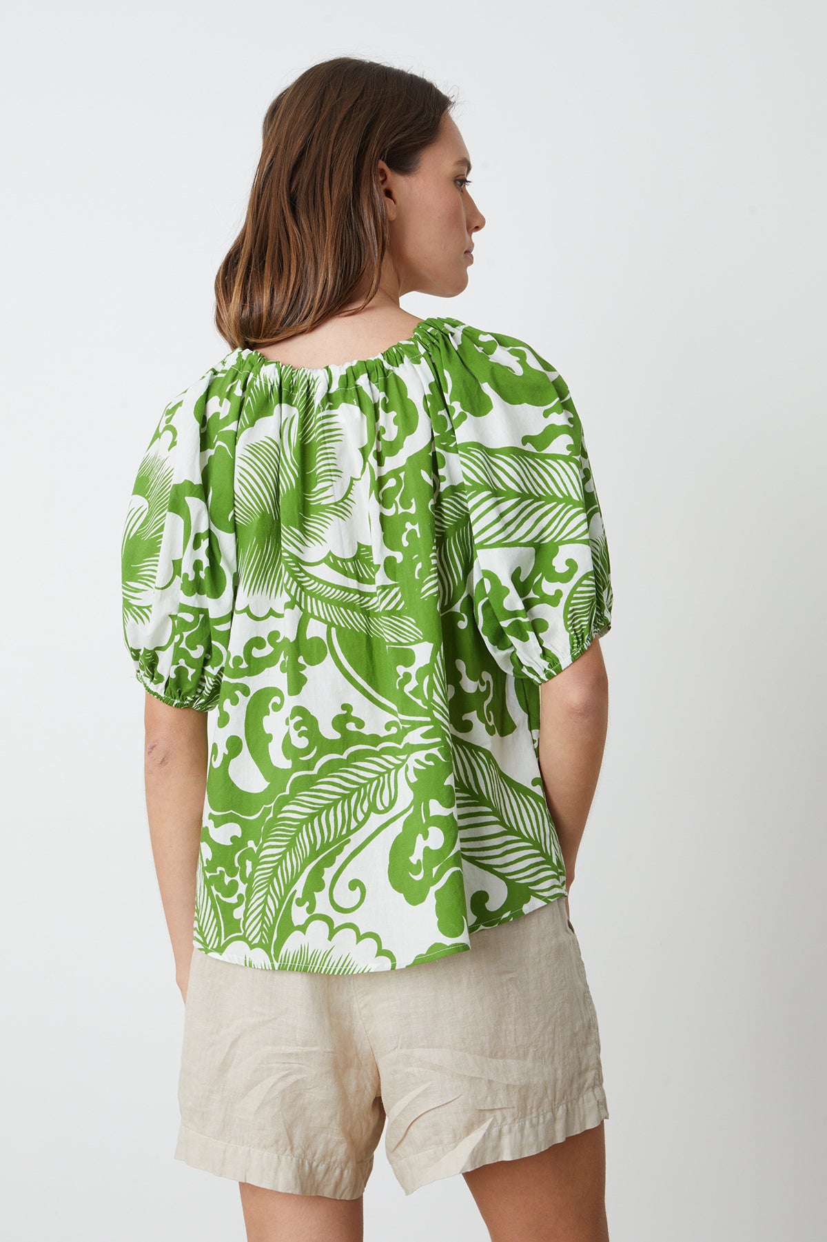   the back view of a woman wearing a Velvet by Graham & Spencer ANGELA PRINTED BOHO TOP. 