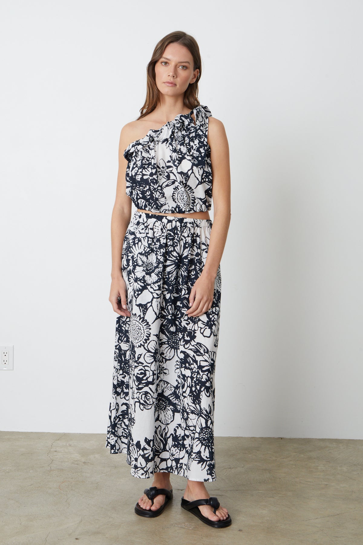 A model wearing a Velvet by Graham & Spencer Juliana Printed Maxi Skirt.-26793045688513